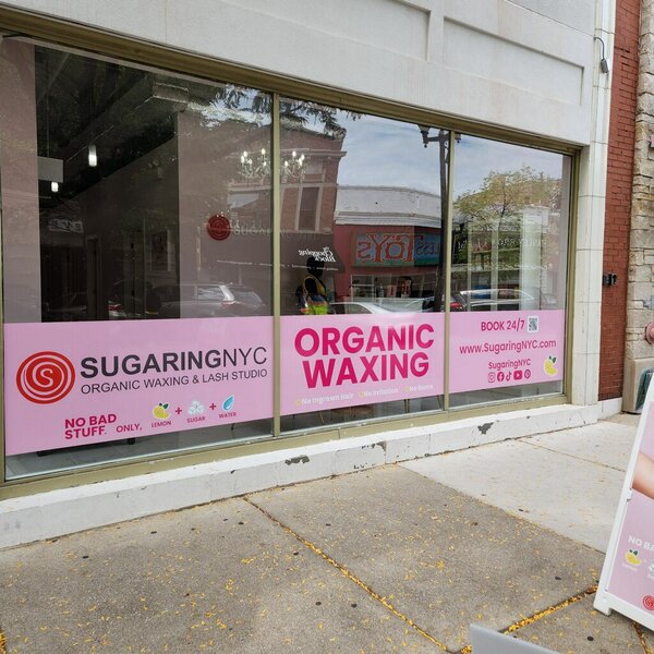 Custom vinyl graphics on storefront for Sugaring NYC