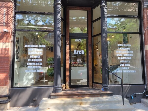 Vinyl window graphics and lettering of Arch business printed by Chicago Signs and Graphics